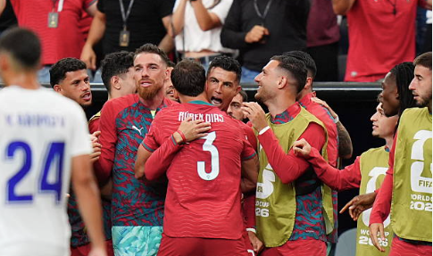 Cristiano Ronaldo applauds Portugal fans after a FIFA World Cup match.